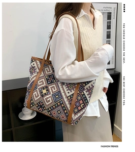 Detail of bohemian tote bag featuring colorful geometric patterns and leather trim