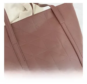 Close-up of quilted geometric stitching and premium texture on dusty pink tote bag