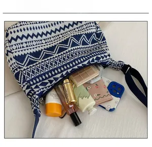 Detailed interior view of a blue geometric pattern canvas tote bag showing large capacity