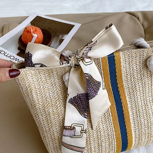 Japanese style straw tote bag with yellow blue vertical stripes and floral silk scarf detail