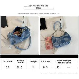 Size chart and capacity detail for blue denim baguette bag with metal chain strap