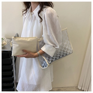 Chic two-in-one transparent tote with white M-pattern and matching inner clutch bag