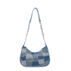 Retro Y2K denim patchwork baguette bag with frayed edges and metal chain strap