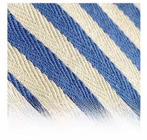 Macro shot of blue and white diagonal striped knit fabric texture with high quality fiber detail