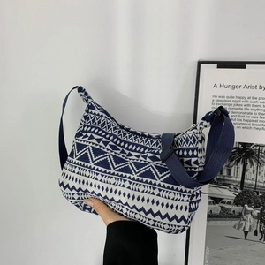 Ethnic geometric pattern canvas crossbody bag with navy blue jacquard weave texture