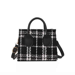 Sac à main chic en tweed à carreaux noir et blanc avec poignées en cuir et bandoulière