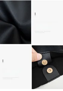 Detail view of high-quality black litchi grain leather and magnetic gold closure