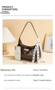 Detail view of small brown PU leather underarm bag with dimensions 24x6.5x14cm