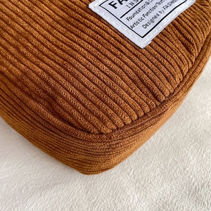 Caramel corduroy mini shoulder bag with textured fabric and fashion logo patch