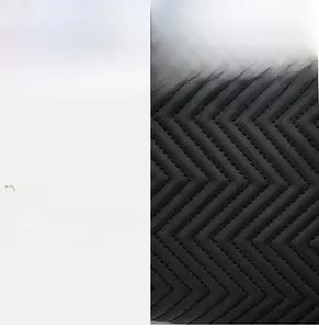 Detail of premium wave-quilted black leather surface with durable stitching and soft texture