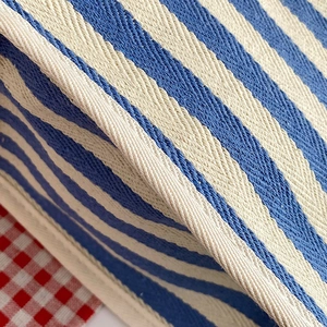 Blue and white herringbone stripe tote bag handle with detailed woven texture design