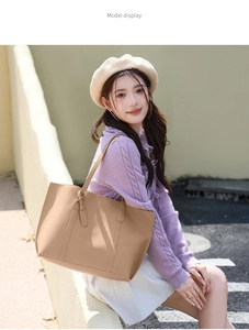 Outdoor lifestyle shot of a large khaki brown soft leather tote bag for women
