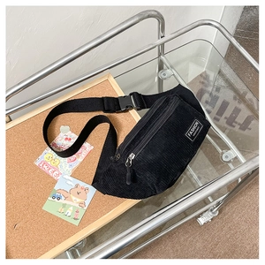 Detail showing high-quality corduroy fabric texture and Fashion Instinct label on chest bag