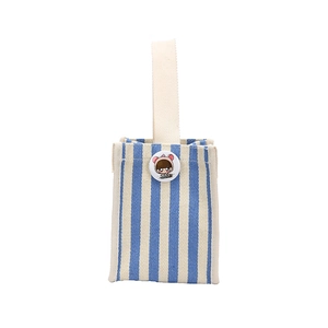 Blue and white striped canvas tote bag with a cartoon girl patch on the front