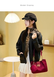 Fashionable burgundy velvet tote bag styled with black leather jacket and leopard scarf