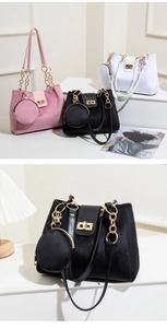 Detail of velvet tote bag with metal twist lock and round coin purse accessory
