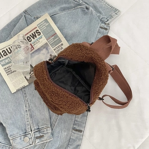 Brown teddy fleece mini backpack with adjustable strap on a casual background