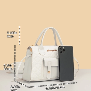 White quilted handbag with gold twist lock and dimensions shown from a front-side angle