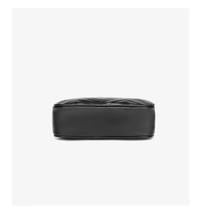 Detailed bottom view of black leather bag featuring premium chevron quilted stitching details