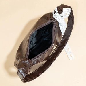 Deep coffee crescent underarm bag with white lace trim and smooth PU leather finish