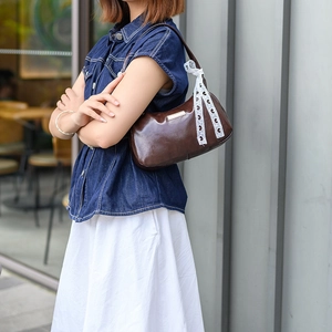 Chic dark coffee baguette bag with lace ribbon and metallic logo plate for women