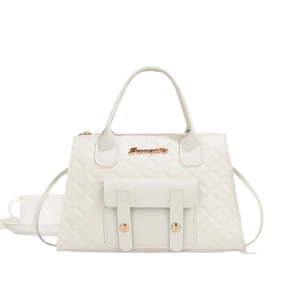 Elegant white quilted crossbody handbag with gold hardware and curved top handle for women