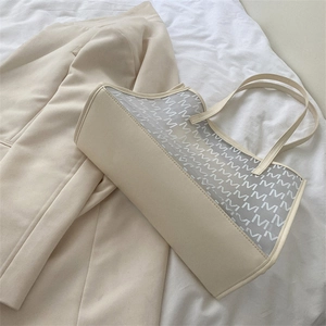Minimalist beige PU tote bag featuring mesh panel with white M-letter pattern