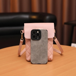 Pink quilted crossbody phone bag with classic diamond pattern and gold hardware strap