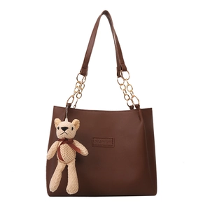 Brown vintage faux leather tote bag with gold chain strap and cute bear charm pendant