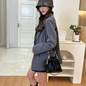 Fashionable black leather drawstring bucket bag with gold chain and matching coin purse
