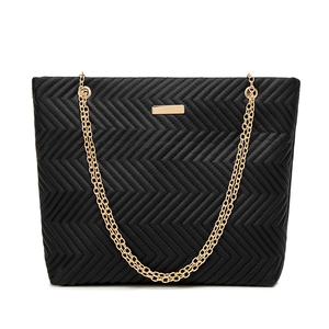 Women's black V-quilted tote bag with gold chain straps and sleek minimalist design