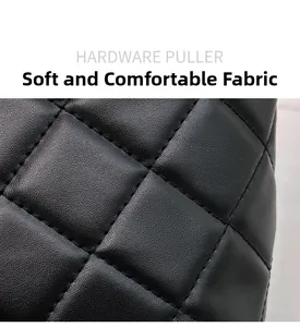 Close-up of black quilted leather texture with soft grain and precision stitching