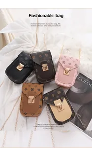Detailed arrangement of mini crossbody phone bags with vintage floral prints and gold chains