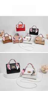 Quilted crossbody bags in six colors featuring gold twist locks and silk scarf handles