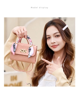 Pink quilted crossbody bag with golden twist lock and elegant floral scarf wrap handle