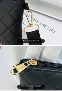 Detail of detachable gold metal clasp and smooth heart zipper on black quilted bag