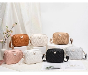 Detailed grid of quilted camera bags with butterfly buckles in seven vibrant colors