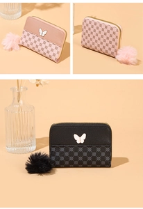 Detail of compact zip wallets with butterfly charms and plush pom-poms in pink and black