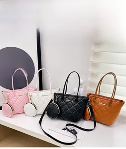 Detailed view of quilted faux leather tote bags in pink, white, black, and brown colors