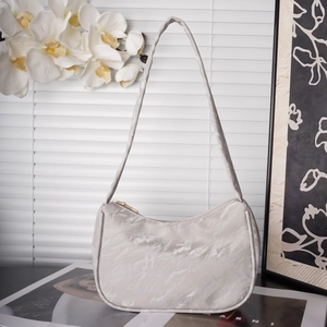 Detail of grey marble textured shoulder bag with golden zipper and sleek strap