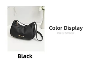 Close-up of black lychee grain texture and golden logo on fashion underarm bag