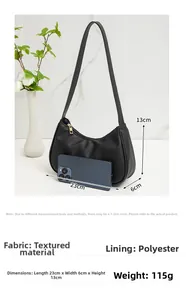 Detail showing litchi grain texture on the black crescent shoulder bag and size dimensions