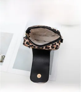 Detailed interior view of leopard print crossbody phone bag showing inner lining and magnetic snap