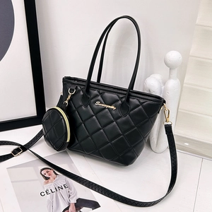 Quilted black leather bucket bag with gold chain strap and mini round coin purse
