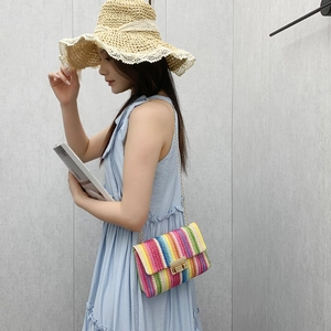 Rainbow woven crossbody bag with golden chain strap for 2025 summer resort style