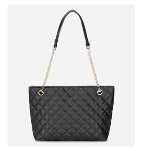 Close-up of quilted embroidery pattern and gold chain strap on black tote bag