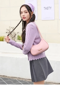 Pink crescent hobo bag in lychee texture grain leather with elegant gold metal logo