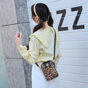 Vintage leopard print vertical crossbody phone bag with gold crown tassel and black strap