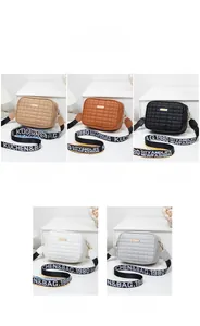 Quilted square camera bags shown in five colors with wide graphic shoulder straps