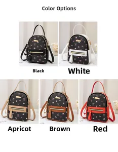 Five small floral backpacks in black with various color accents and golden zippers